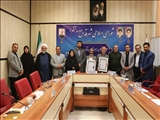 تجلیل از خانواده شهیدان گروسی و كارگردان شهرقدسی