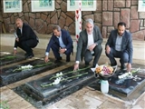 عطر افشانی گلزار شهدای میگون