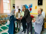تجلیل سرپرست بخشداری کن از معلمان مدرسه بدری برهانی روستای کیگا