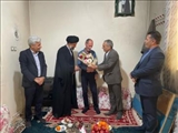 تجلیل از خانواده شهید عباس کریمی و جانباز سرافراز سید حسین سیدی در نصیرشهر